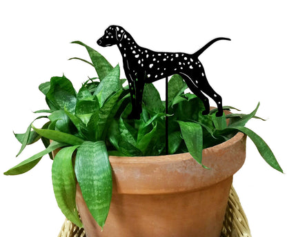 Dalmatian plant stake in black metal silhouette with white spots perched above a potted green plant on Tampa Home & Garden Store