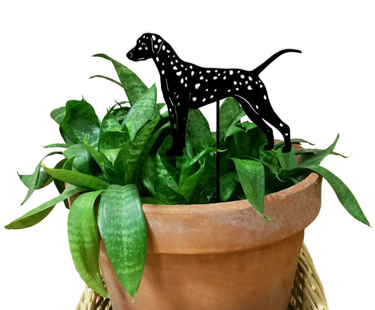 Dalmatian plant stake in black metal silhouette with white spots perched above a potted green plant on Tampa Home & Garden Store