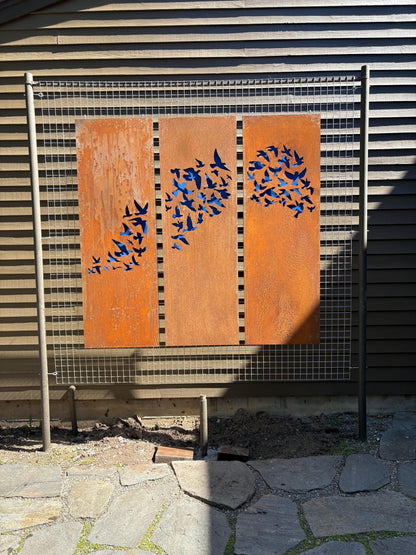 Outdoor metal wall art panels with a rusty finish and blue bird silhouettes, set of 3 panels on Tampa Home & Garden Store