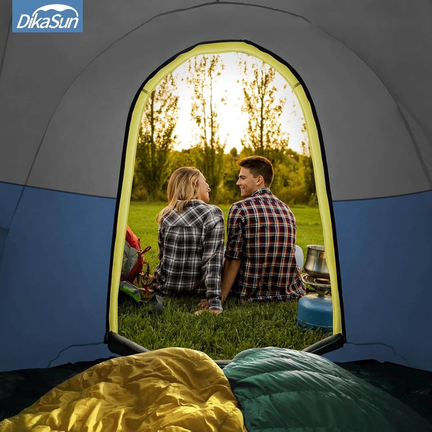 Pickup truck bed tent by Dikasun Outdoor with neon lime doorway; couple sits on grass inside on Tampa Home & Garden Store