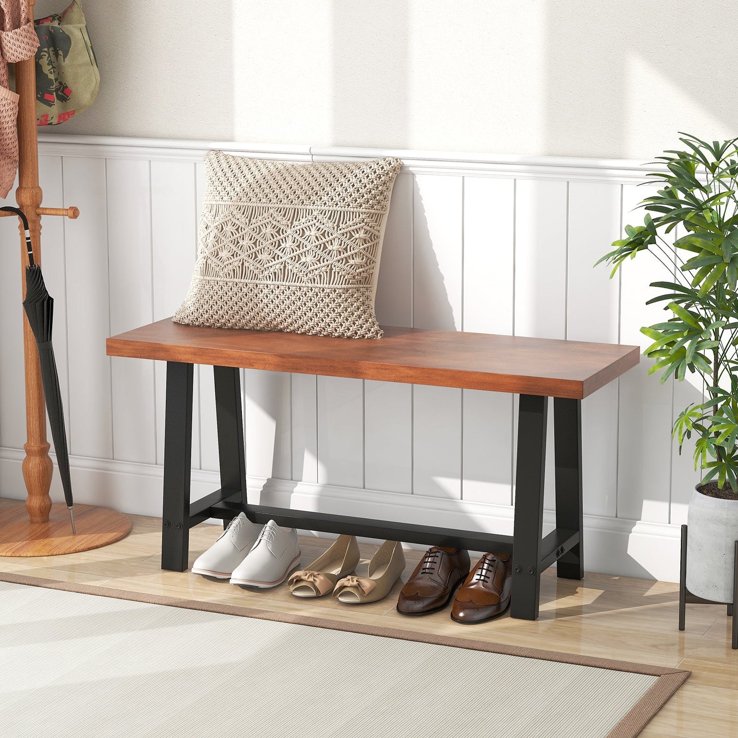 40 Inch Dining Bench with metal frame, warm wood top, beige cushion, shoe storage, plant nearby on Tampa Home & Garden Store