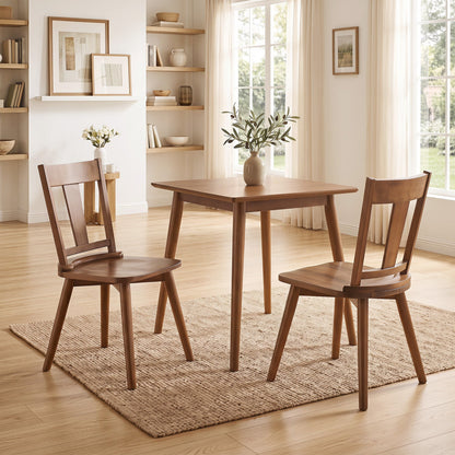 Solid wood dining chairs set of 2 with ergonomic backrests around a wooden table in a dining room on Tampa Home & Garden Store