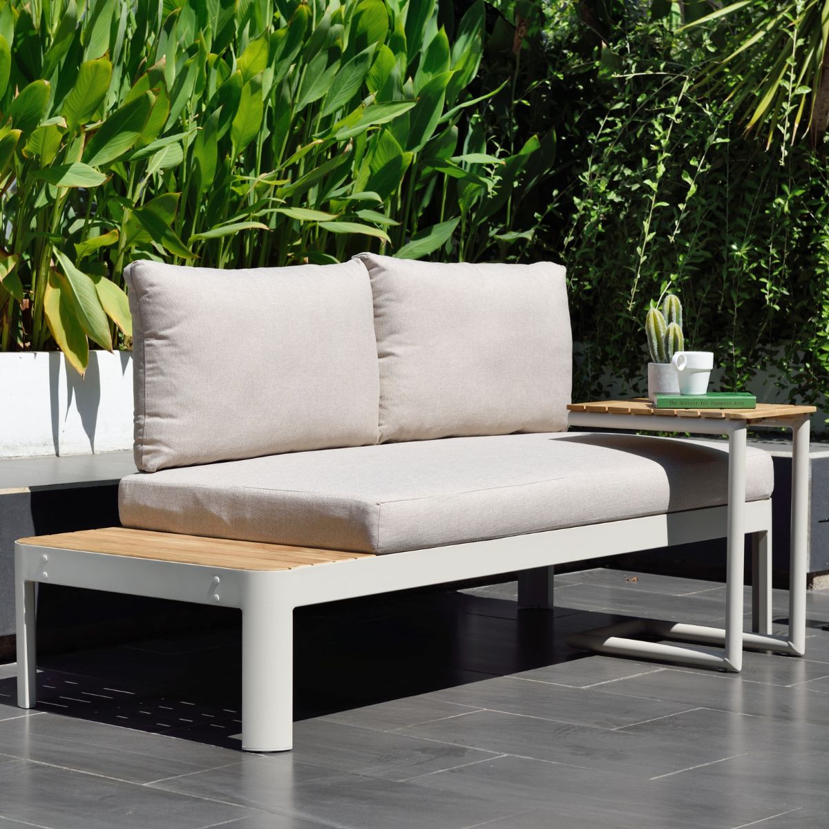 Portals Light C-Shape outdoor sofa with beige cushions and white frame, side table on Tampa Home & Garden Store