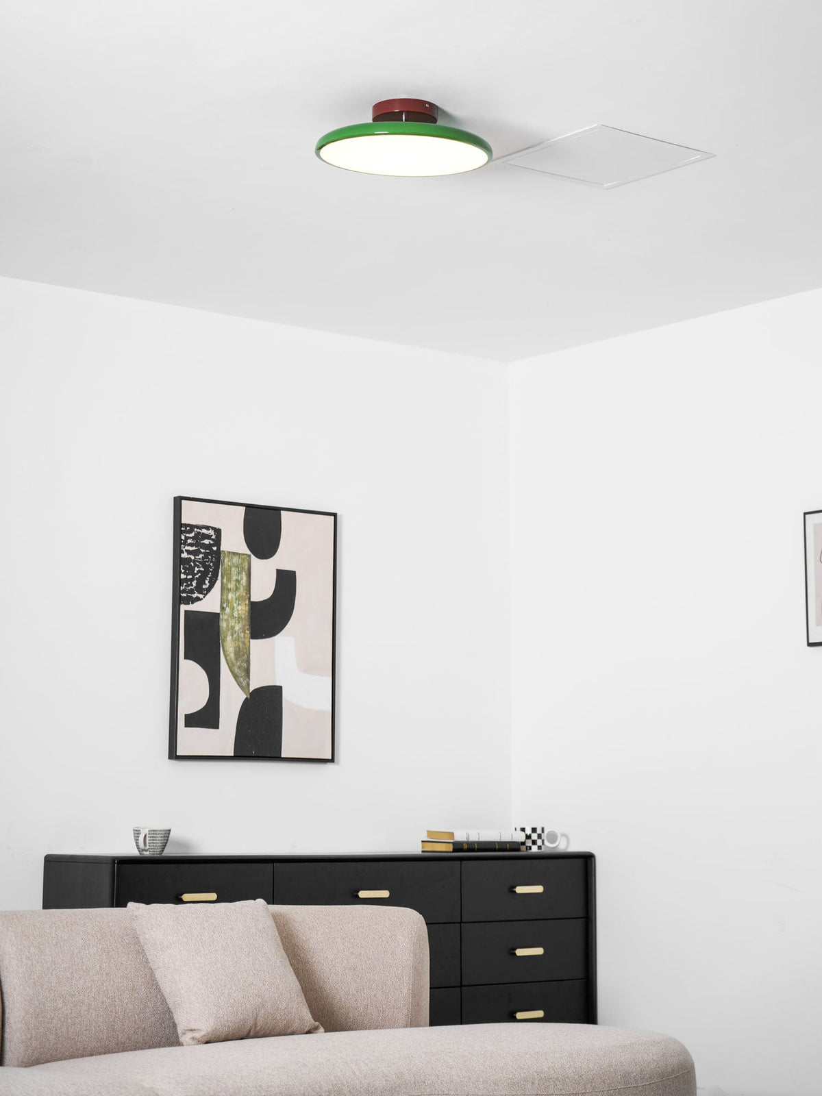 Orbitra flush mount LED ceiling light with green rim and brown base, dimmable in modern space on Tampa Home & Garden Store