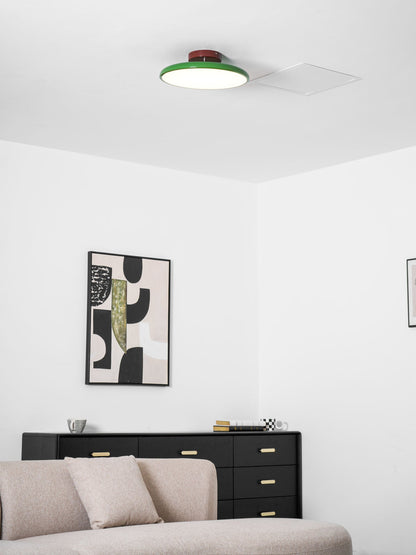 Orbitra flush mount LED ceiling light with green rim and brown base, dimmable in modern space on Tampa Home & Garden Store