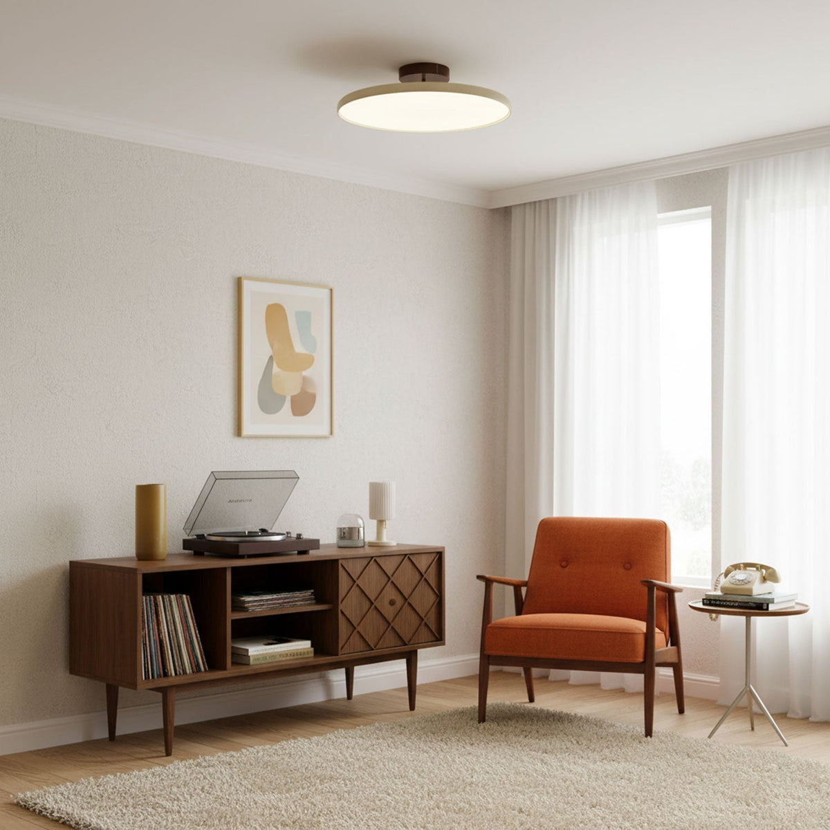 Orbitra flush mount LED ceiling light with swivel arm, round white diffuser in living room on Tampa Home & Garden Store