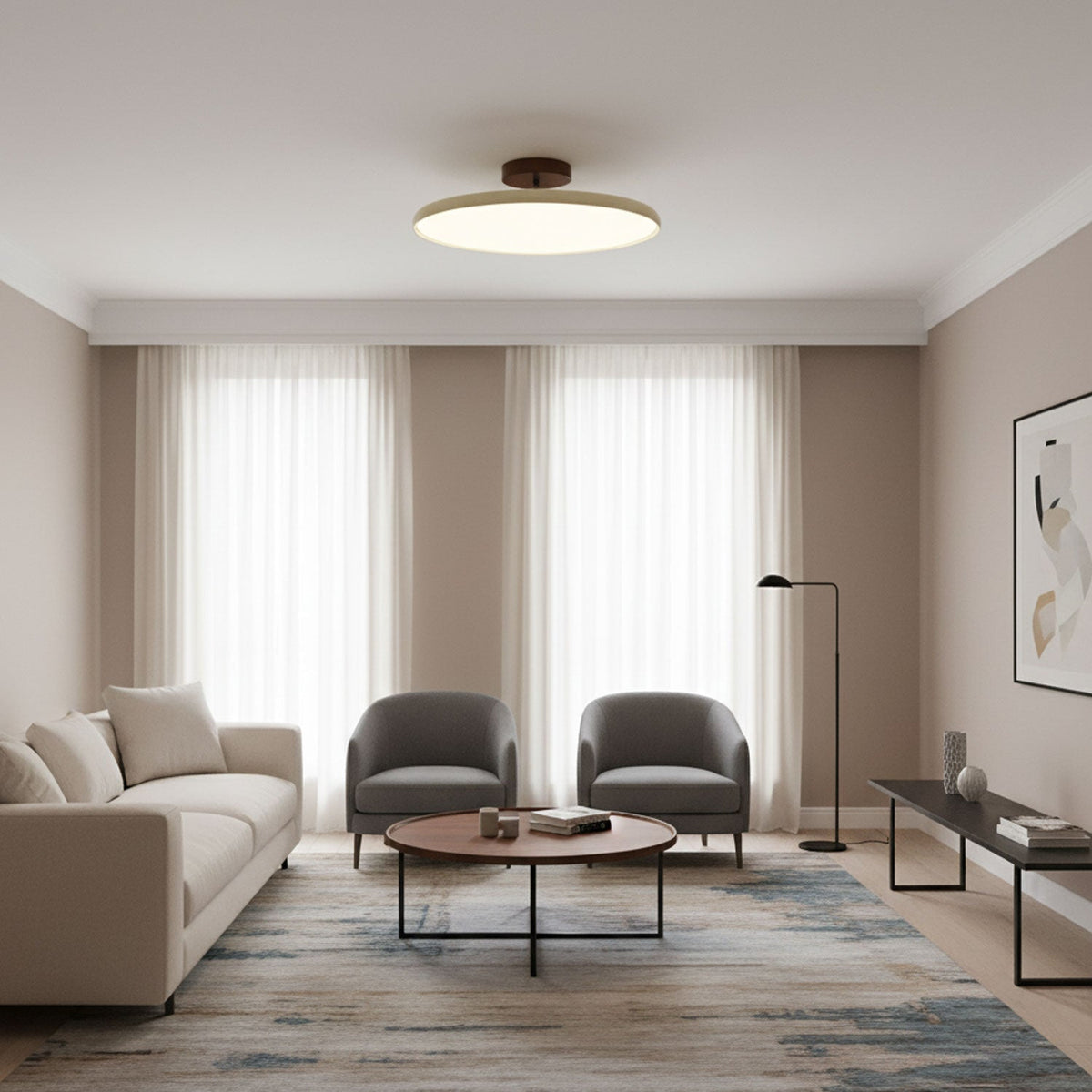 Orbitra flush-mount LED ceiling light in beige finish by Moktan Sabai over a modern living room on Tampa Home & Garden Store