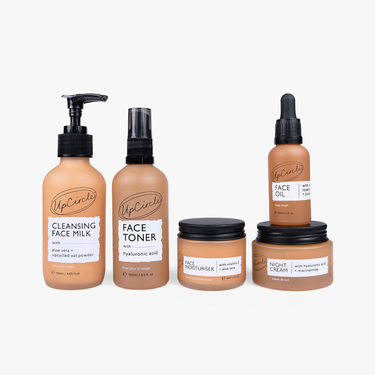 The Dry Skin Bundle by UpCircle: five tan skincare bottles and jars with black caps on Tampa Home & Garden Store