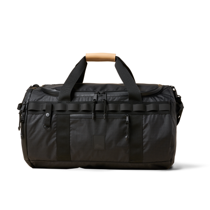 Duffalo duffel bag by The Brown Buffalo in black ripstop with tan leather handle wrap and rugged straps on Tampa Home & Garden Store