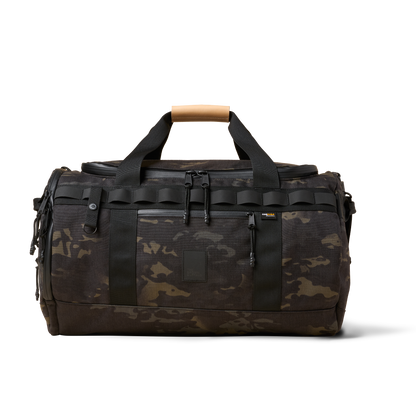 Duffalo duffel bag The Brown Buffalo in dark camo with straps and tan leather grab handle on Tampa Home & Garden Store