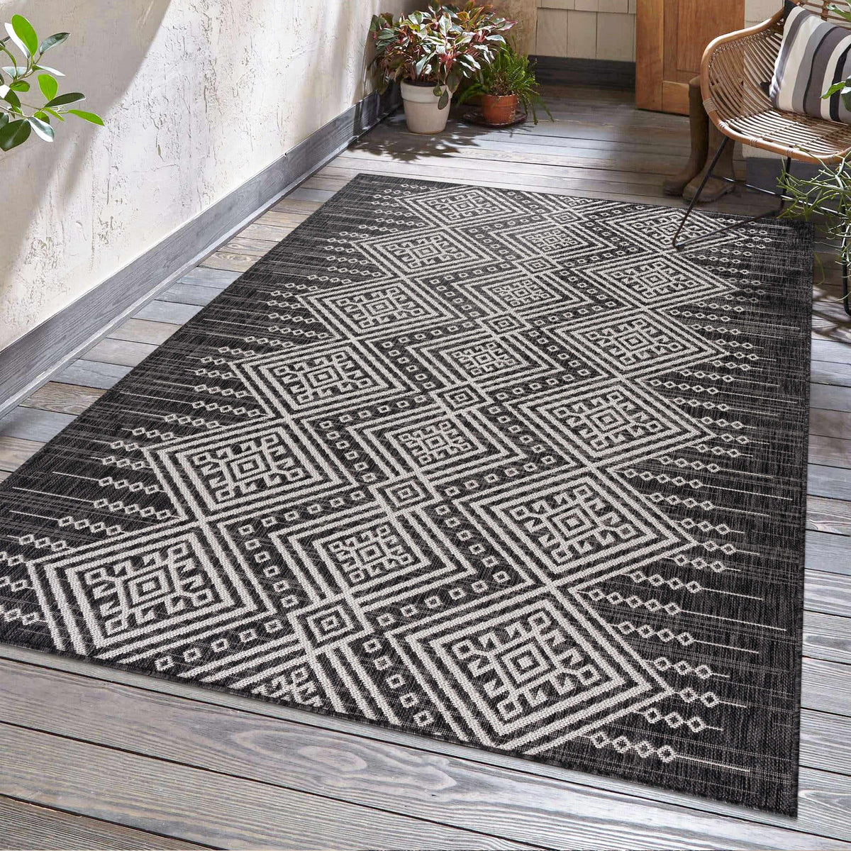 Frankville Black&White Performance Outdoor Rug with geometric pattern on wooden deck on Tampa Home & Garden Store