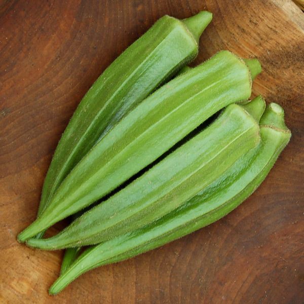 Okra pods Clemson Spineless 80, green ridged on wood board on Tampa Home & Garden Store