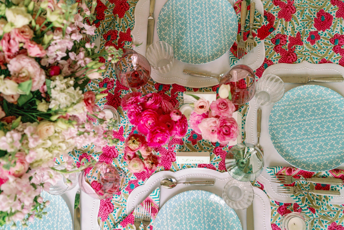 Slate blue Ivy Manor china plates by Erin Donahue Tice arranged on a floral table setting on Tampa Home & Garden Store