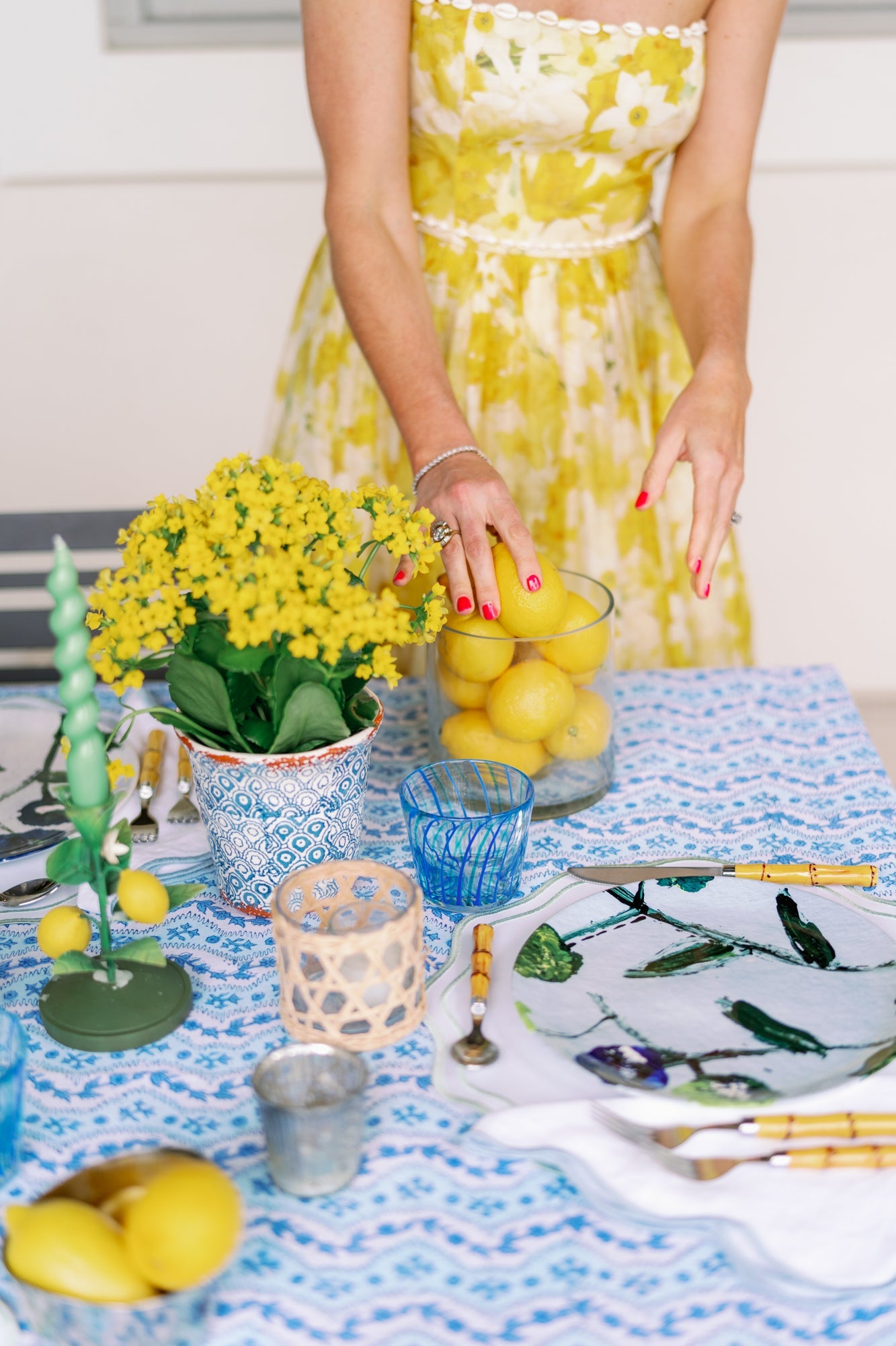 Lemon Posey china plates set with lemon motif on a blue patterned table setting on Tampa Home & Garden Store