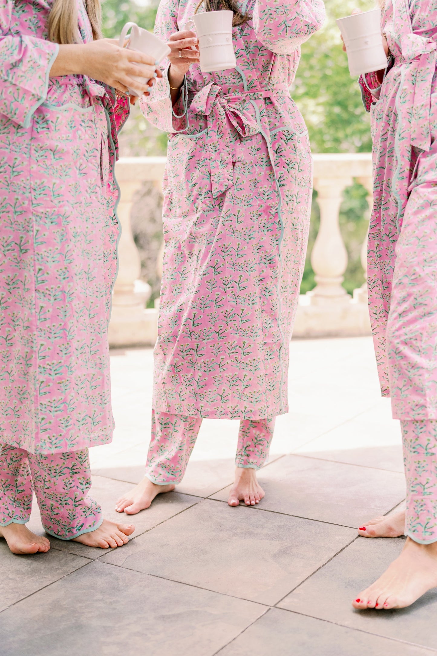 Adult Sydney Robe Tulip Pink with teal piping belt tied robe worn by 3 barefoot women on Tampa Home & Garden Store