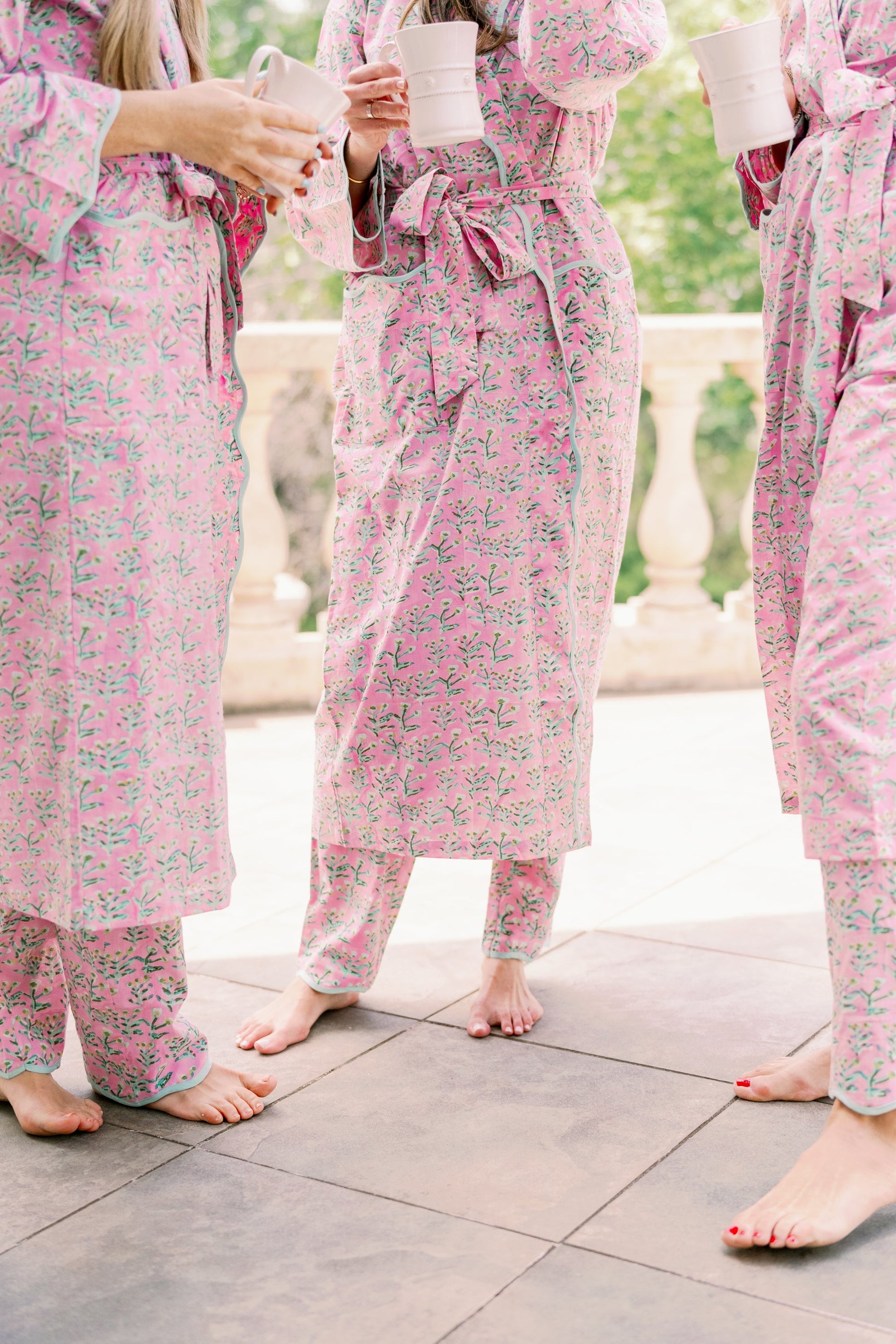 Adult Sydney Robe Tulip Pink with teal piping belt tied robe worn by 3 barefoot women on Tampa Home & Garden Store