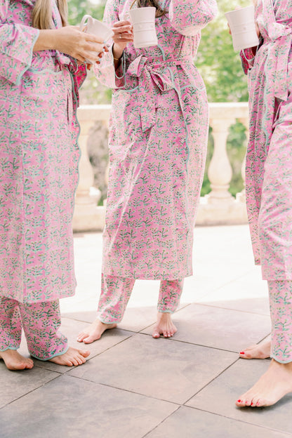 Adult Sydney Robe Tulip Pink with teal piping belt tied robe worn by 3 barefoot women on Tampa Home & Garden Store