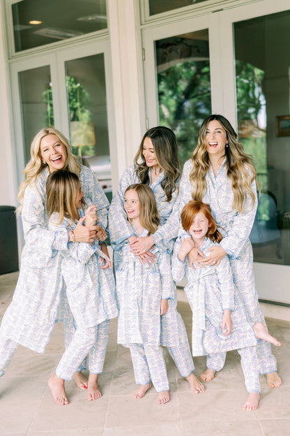 Mini Trellis Pajama set in blue by Erin Donahue Tice, worn by a group of women and children in matching sleepwear on Tampa Home & Garden Store