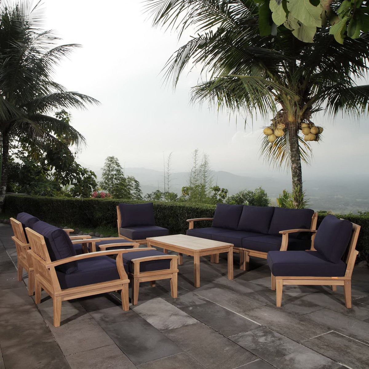 Marina 10 Piece Outdoor Teak Set with navy cushions on teak frames on Tampa Home & Garden Store