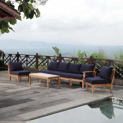 Marina 7-Piece Outdoor Teak Sofa Set with navy cushions on a patio on Tampa Home & Garden Store