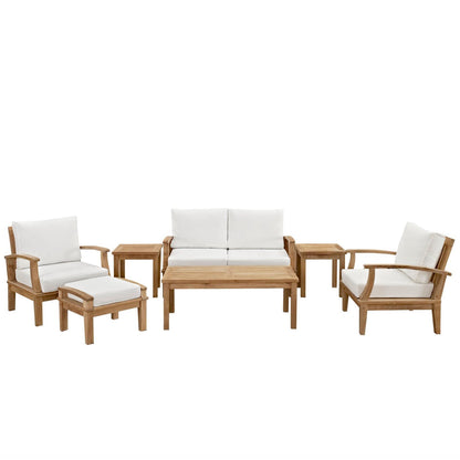 Marina 7-piece teak outdoor set with white cushions including sofa, two armchairs, and coffee table on Tampa Home & Garden Store
