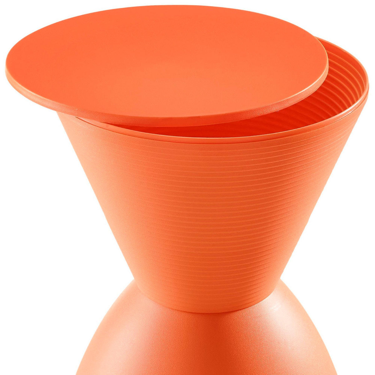 Orange ribbed planter pot closeup with textured exterior on Tampa Home & Garden Store