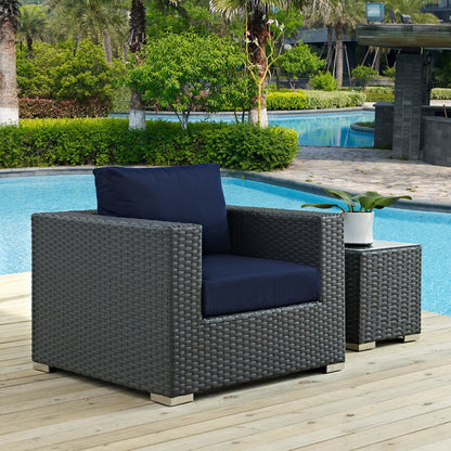 Sojourn outdoor Sunbrella armchairs pair in dark wicker with navy cushions on poolside deck on Tampa Home & Garden Store