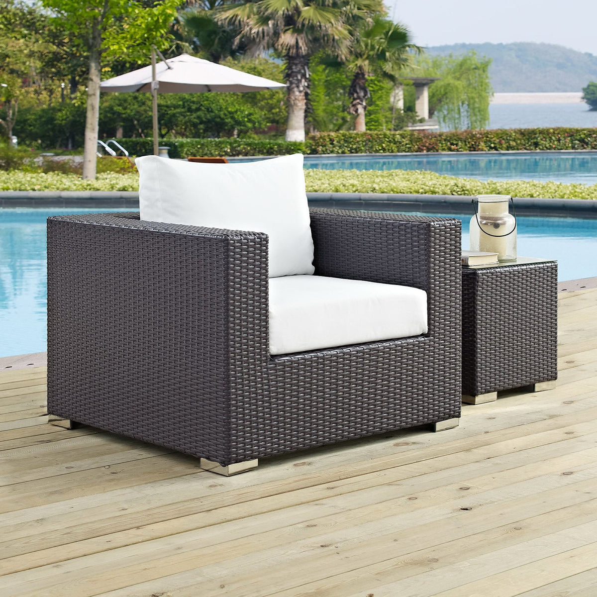 Convene Outdoor Patio Armchairs set of 2 in brown wicker with white cushions poolside on Tampa Home & Garden Store