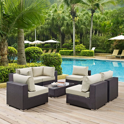 Convene 7-Piece Outdoor Patio Sectional Set in dark wicker with beige cushions by poolside on Tampa Home & Garden Store