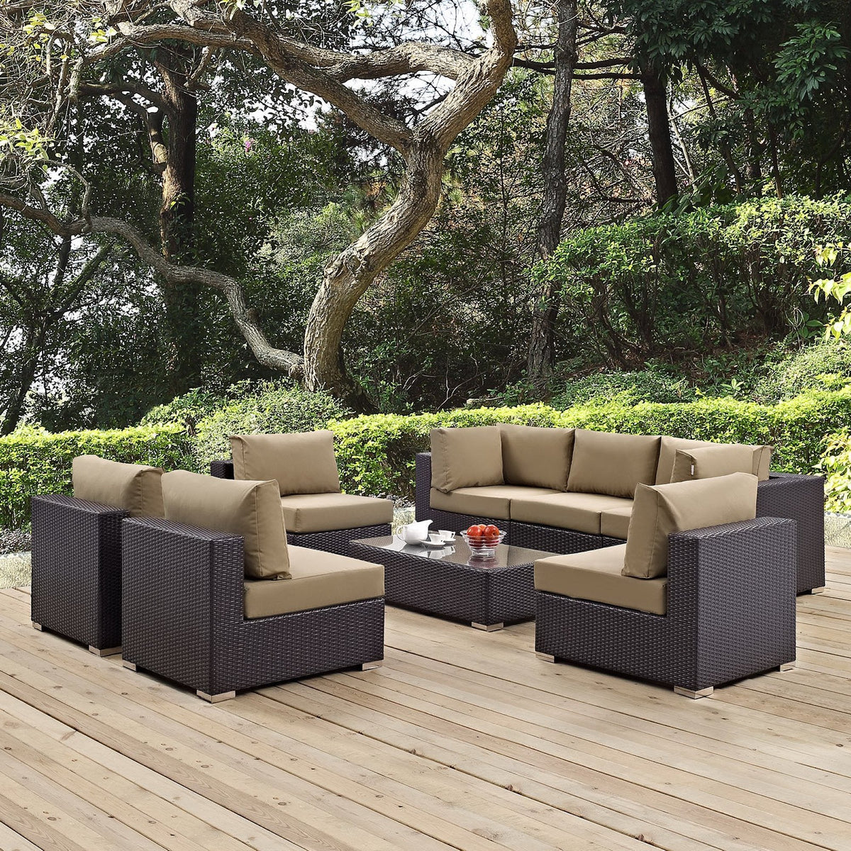 Convene 8-Piece outdoor patio sectional set in dark wicker with tan cushions on a wooden deck on Tampa Home & Garden Store