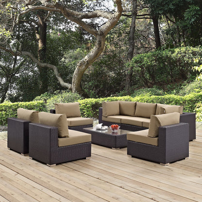 Convene 8-Piece outdoor patio sectional set in dark wicker with tan cushions on a wooden deck on Tampa Home & Garden Store