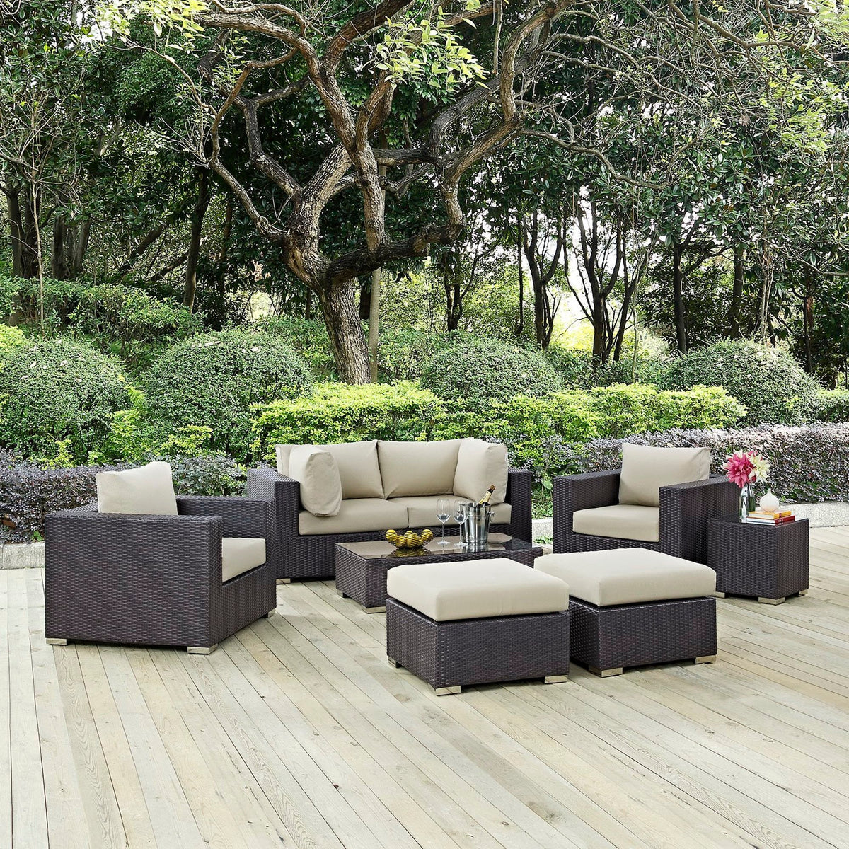 Convene 8 Piece Outdoor Patio Sectional Set dark brown wicker with beige cushions on a deck on Tampa Home & Garden Store