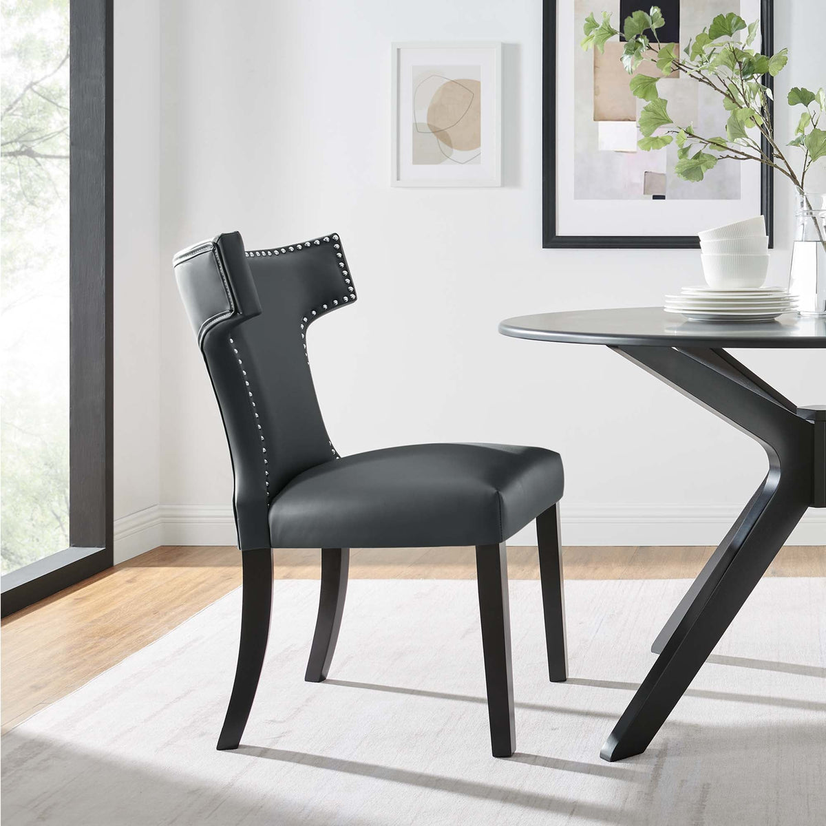 Curve vegan leather dining chair by Modway, black with nailhead trim in a modern dining setting on Tampa Home & Garden Store