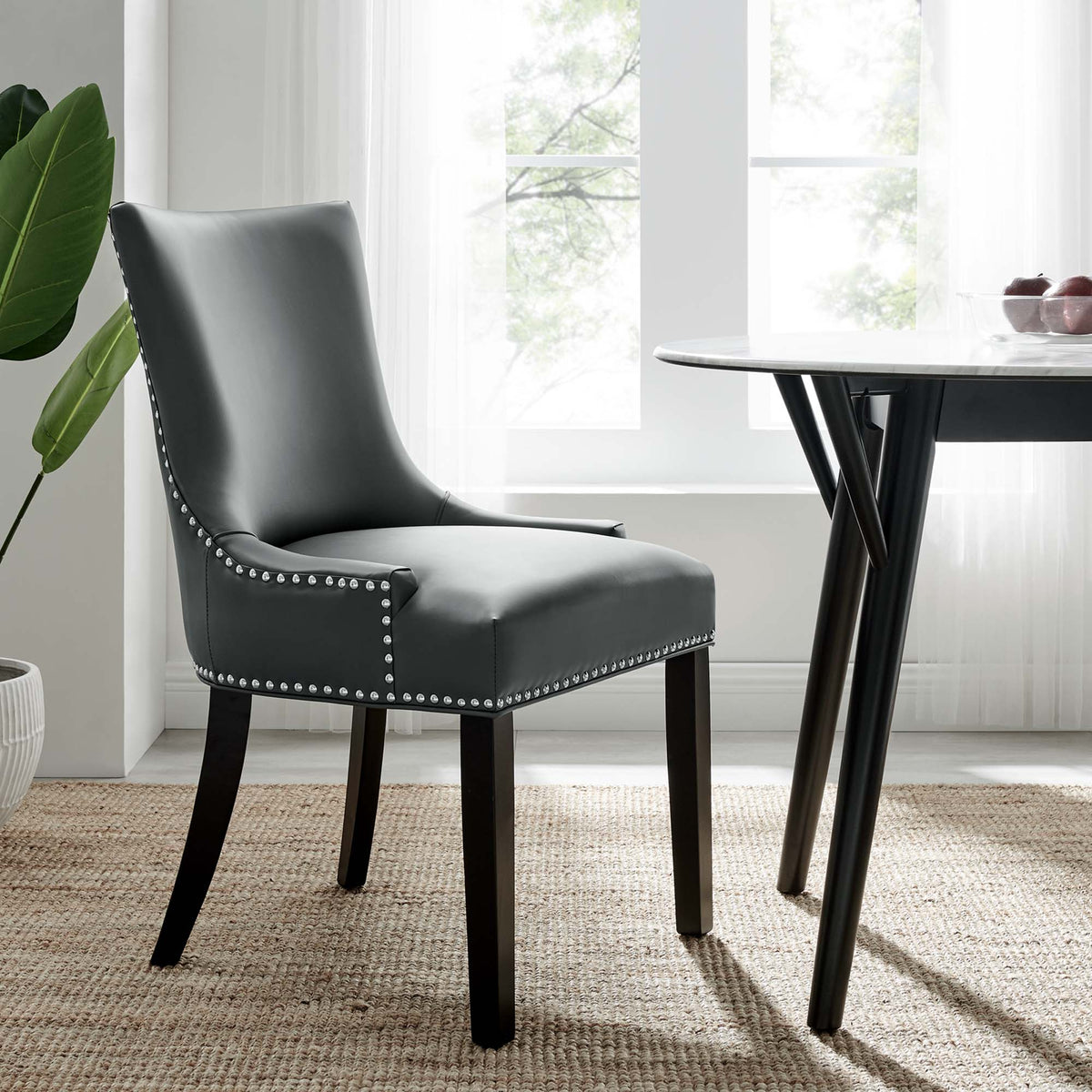 Marquis vegan leather dining chair in black with silver nailhead trim and dark wood legs on Tampa Home & Garden Store