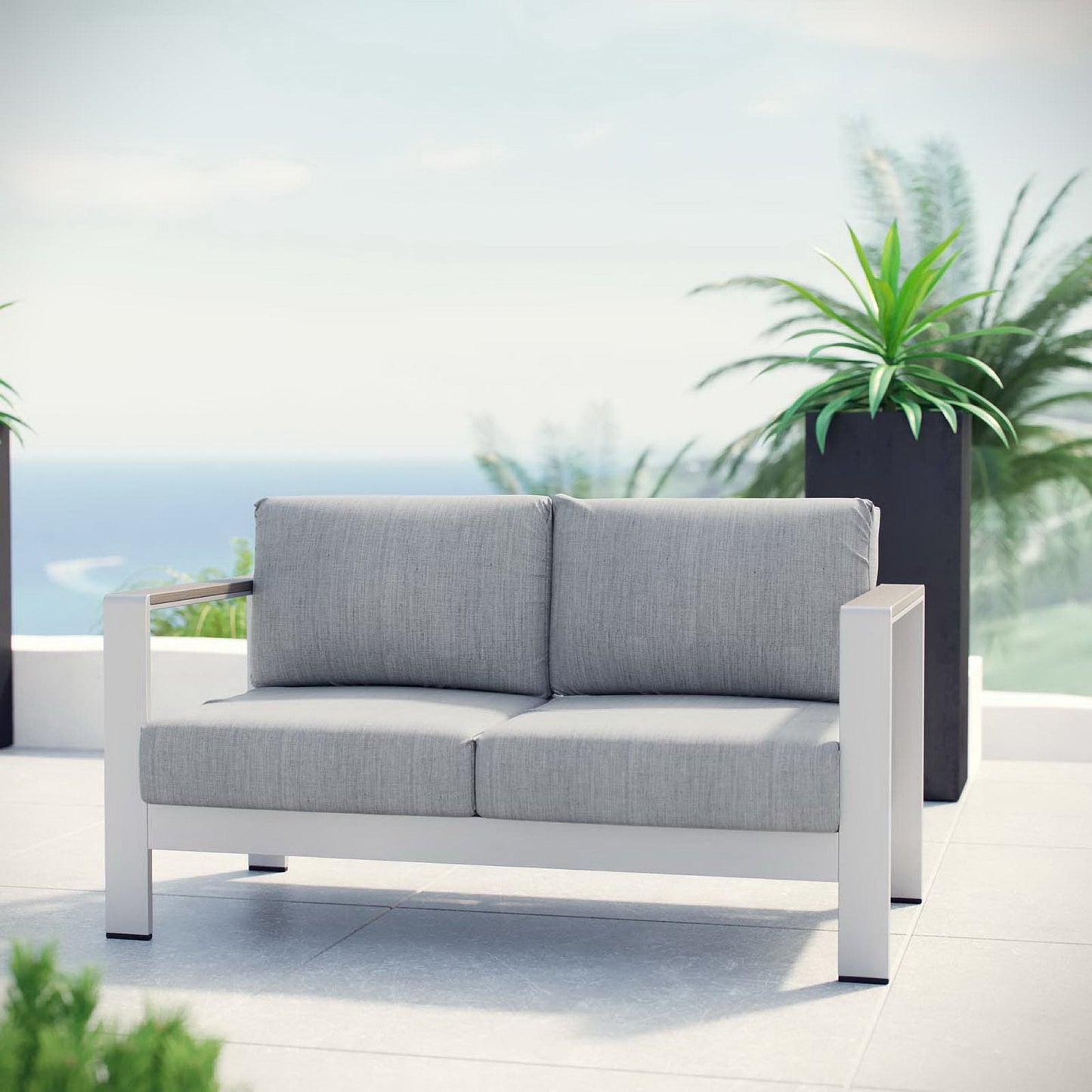 Shore Outdoor Patio Aluminum Loveseat with gray cushions on a white aluminum frame on Tampa Home & Garden Store