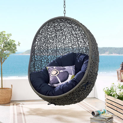 Hide Outdoor Patio Swing Chair by HouseOfZazla black woven egg chair with navy cushions on Tampa Home & Garden Store