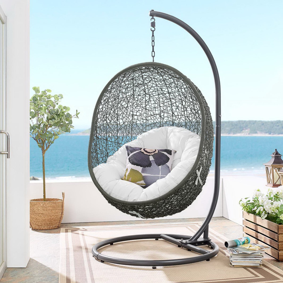 Hide Outdoor Patio Swing Chair With Stand in dark gray woven wicker, white cushions on Tampa Home & Garden Store