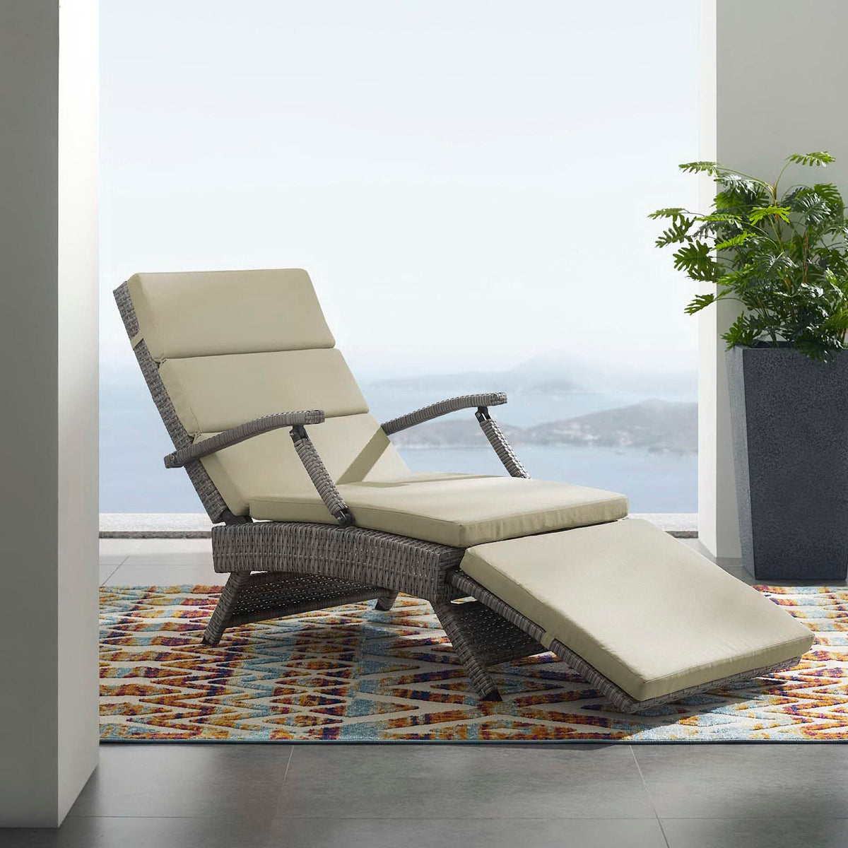 Envisage Chaise Outdoor Wicker Rattan Lounge Chair with beige cushions on woven wicker frame on Tampa Home & Garden Store