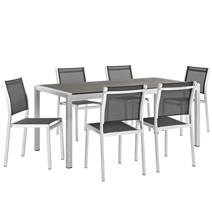 Shore 7-Piece Outdoor Aluminum Dining Set with slatted wood top and six mesh-back chairs on Tampa Home & Garden Store