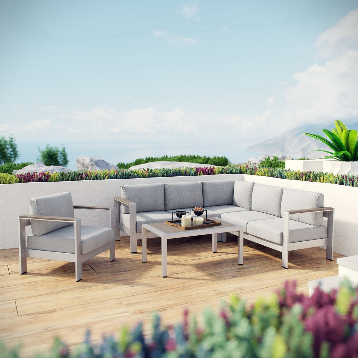 Shore 5-Piece aluminum sectional sofa set with light gray cushions and coffee table on a deck on Tampa Home & Garden Store