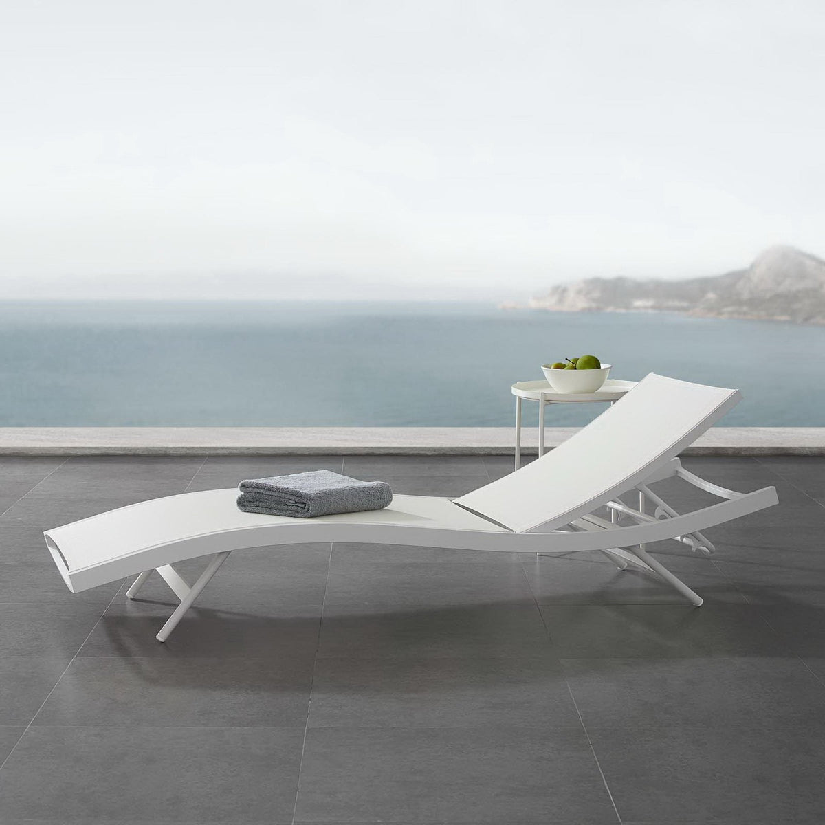 Glimpse outdoor patio mesh chaise lounge chair, white, on gray tile deck with ocean view on Tampa Home & Garden Store