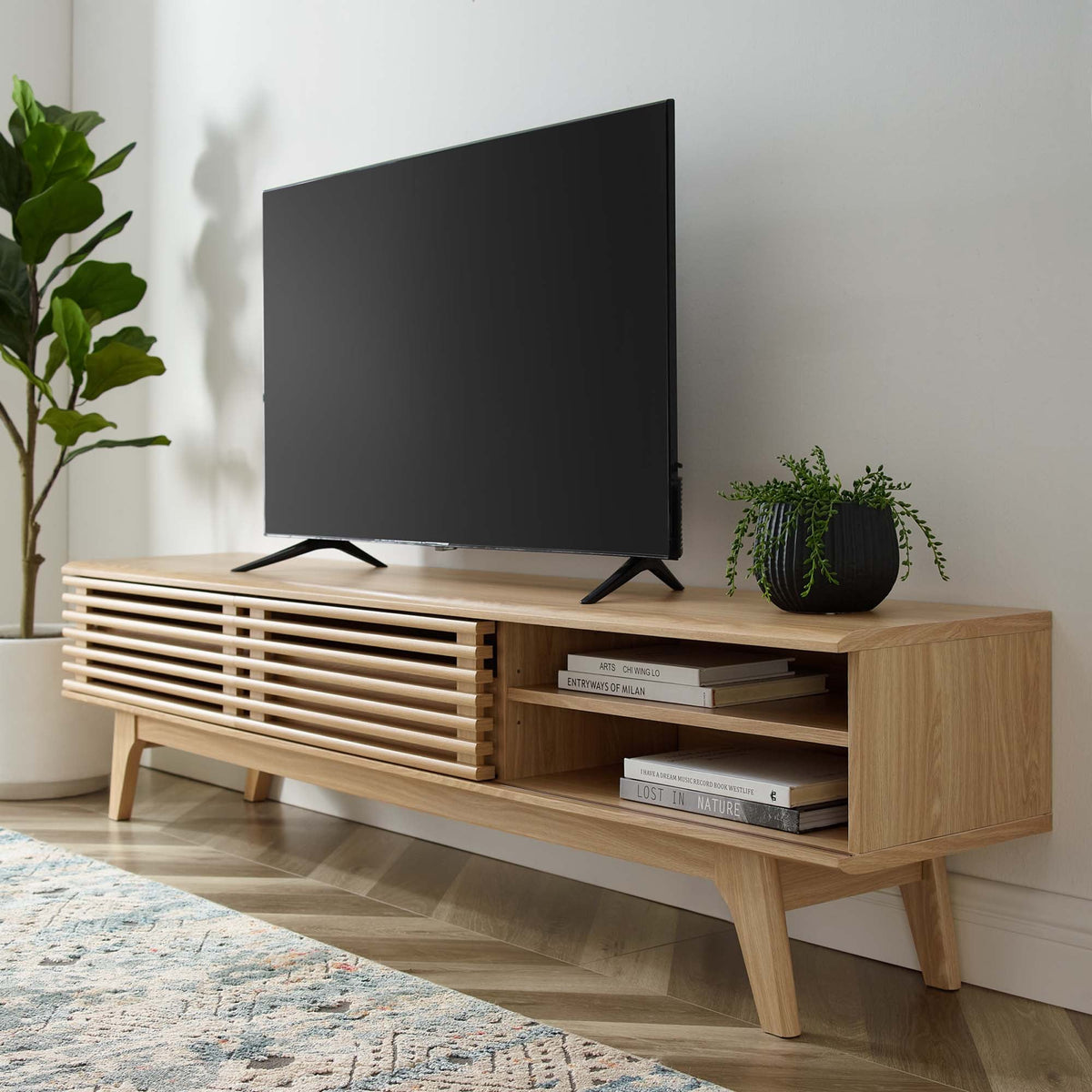 Render TV Stand by Modway in light oak with slatted front, TV on top, plant decor on Tampa Home & Garden Store