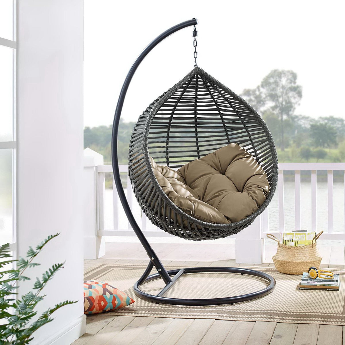 Garner Teardrop Outdoor Patio Swing Chair with beige cushion in dark gray wicker on a circular stand on Tampa Home & Garden Store