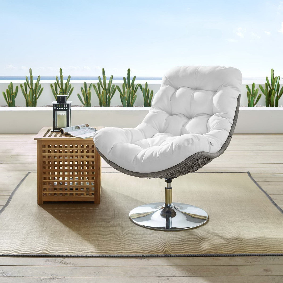 Brighton Wicker Rattan Outdoor Swivel Lounge Chair by Modway with white cushions on a patio on Tampa Home & Garden Store