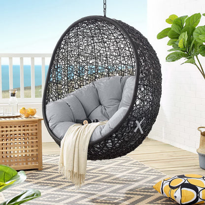 Encase Sunbrella swing lounge chair with dark cushions in a hanging wicker sphere by HouseOfZazla on Tampa Home & Garden Store