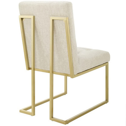 Privy Gold upholstered dining chair with beige fabric and gold-tone metal frame on Tampa Home & Garden Store