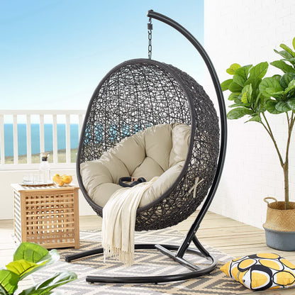 Encase Swing Patio Lounge Chair hanging chair with dark woven rattan and beige cushions on Tampa Home & Garden Store