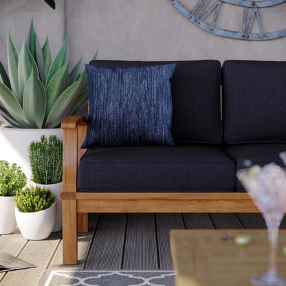 Marina Outdoor Patio Teak Sofa with dark cushions and a blue textured pillow on teak frame on Tampa Home & Garden Store