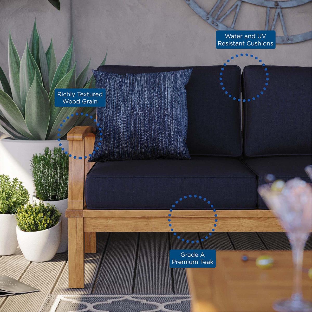 Marina outdoor teak sofa with dark navy cushions on Tampa Home & Garden Store
