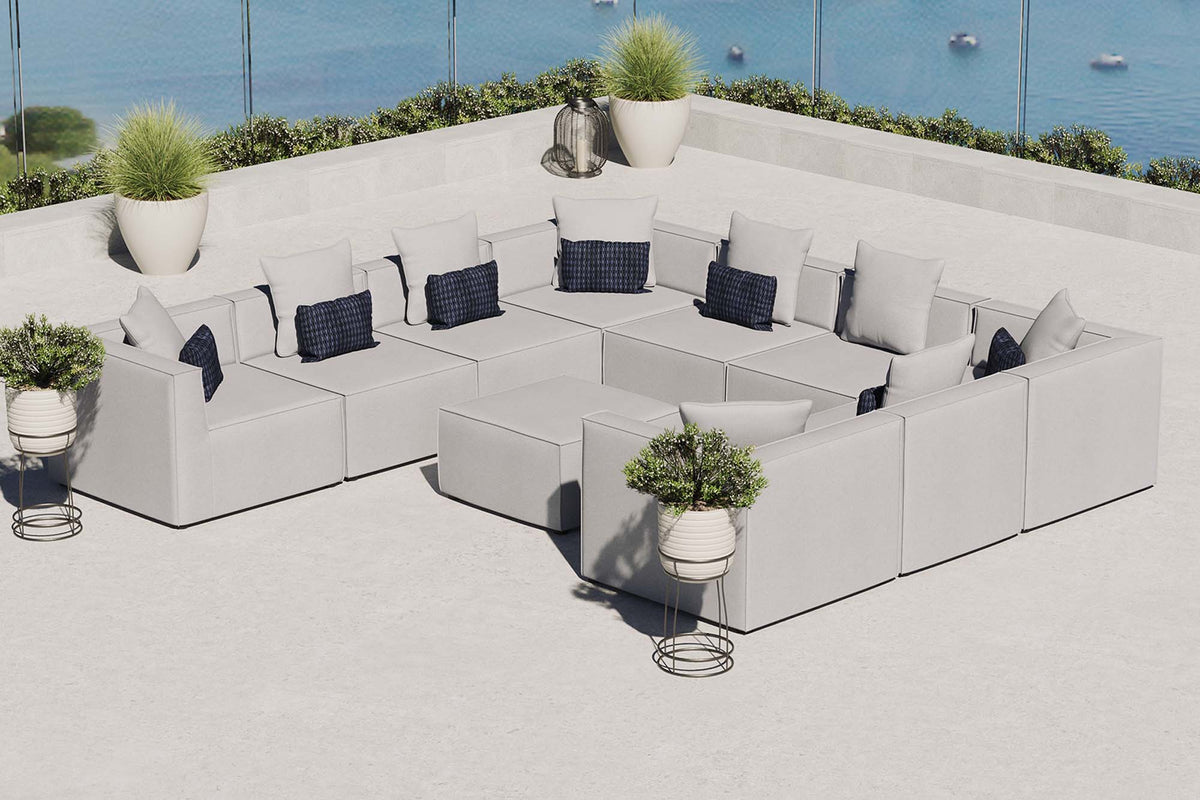 Saybrook 10-Piece outdoor sectional sofa in light gray upholstery with navy cushions on Tampa Home & Garden Store